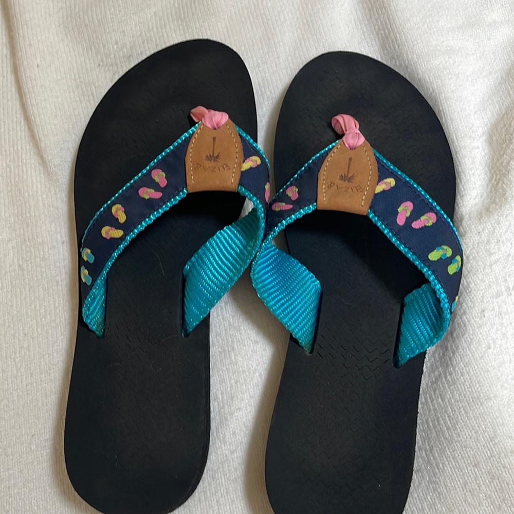 Liza B flip flops.